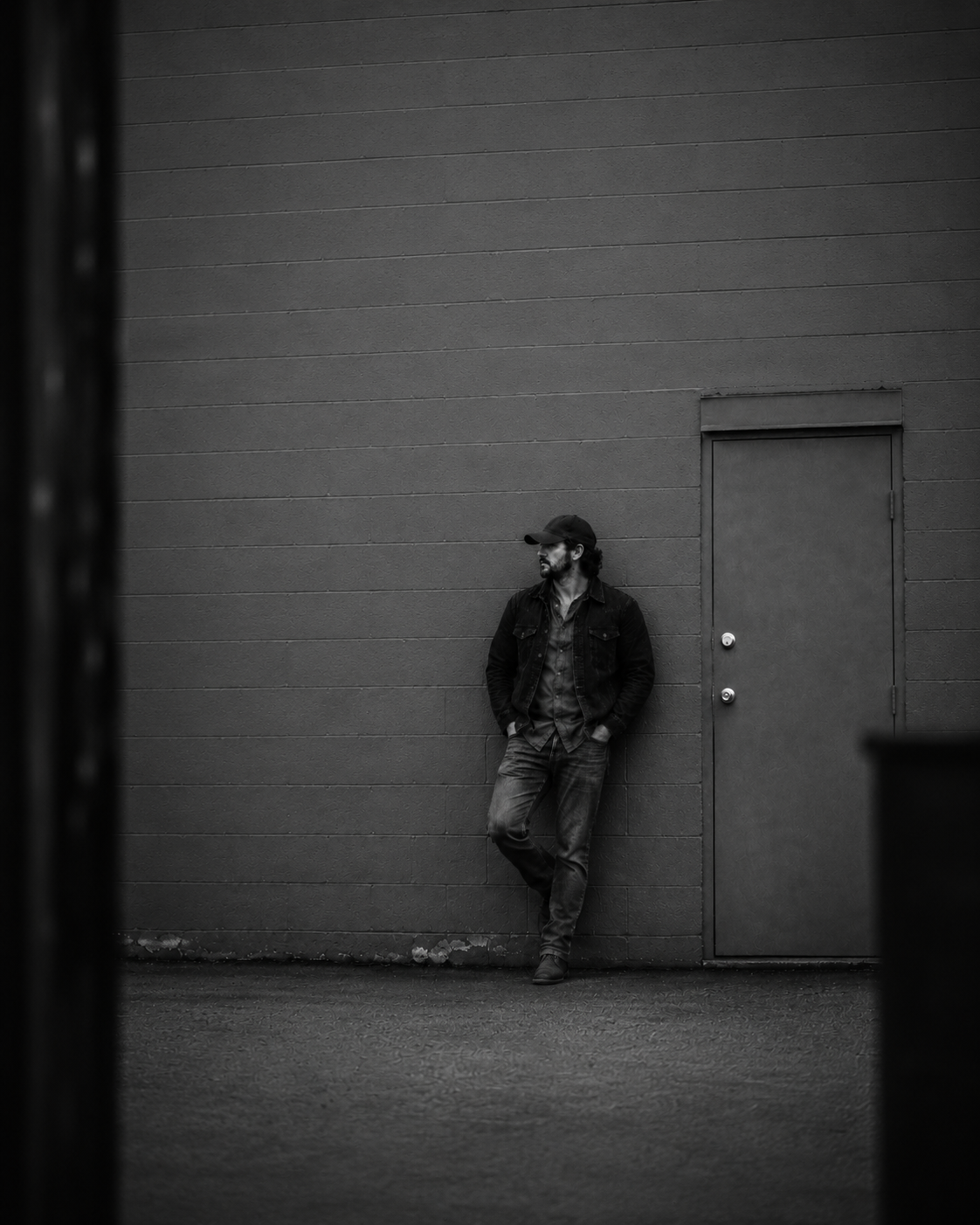 Austin Wild photographed from a distance beside a venue door